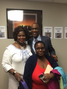 Superintendent Robert Runcie and Community School South Principal Carle Shaw with ESOL student Marie Sonia Nerville